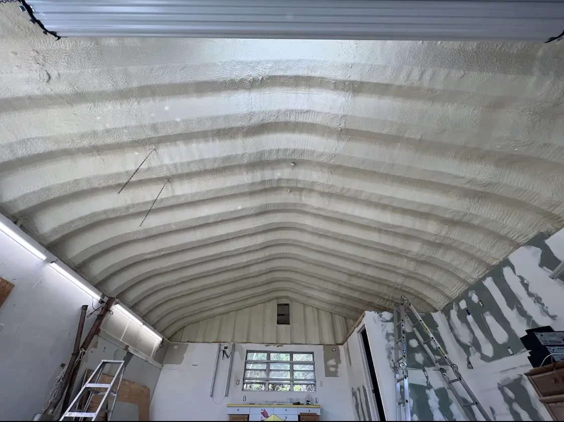 Spray polyurethane foam applied to the underside of a metal roof deck in Highland Lakes